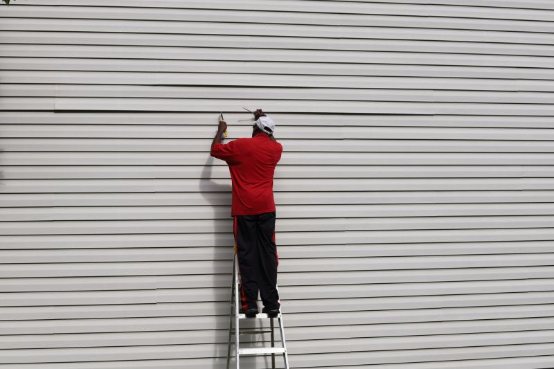 Re-securing Siding Panels